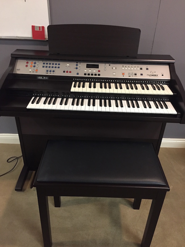 Used lowrey store piano prices